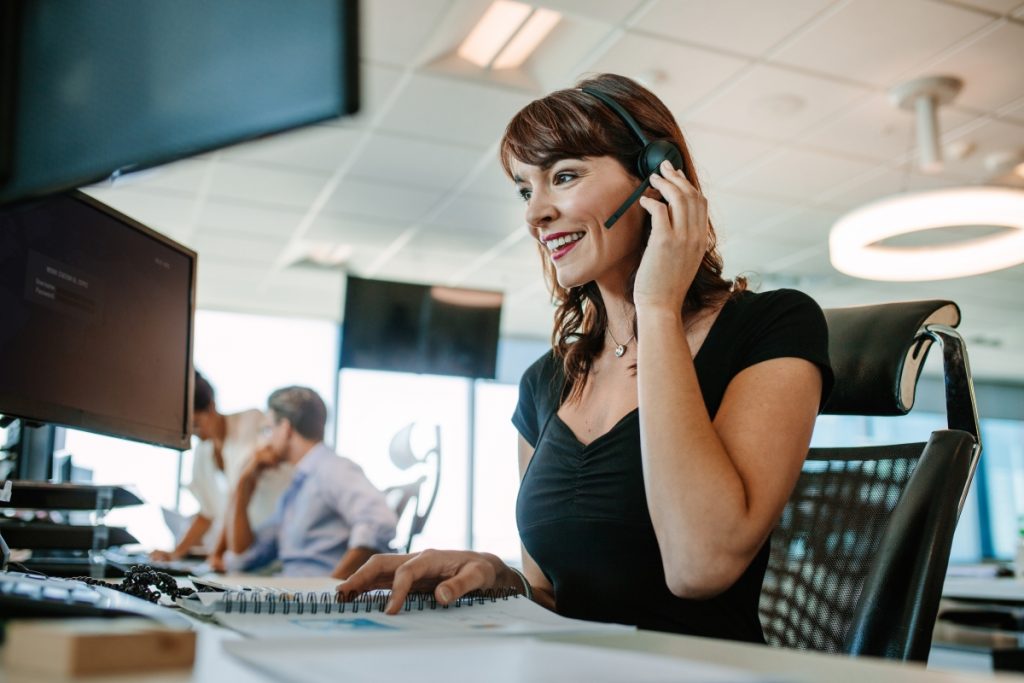 woman on phone headset in office