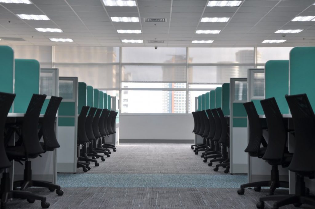 clean office with lines of empty cubicles
