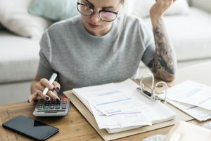 Female small business owner doing calculations